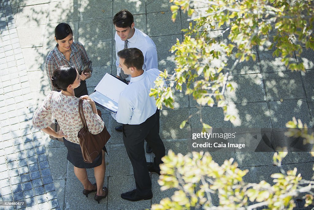 Business people talking outdoors