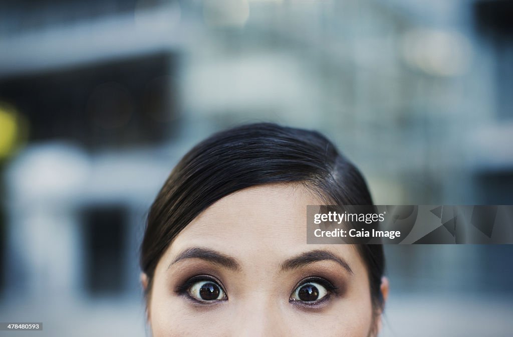 Close up of wide-eyed woman