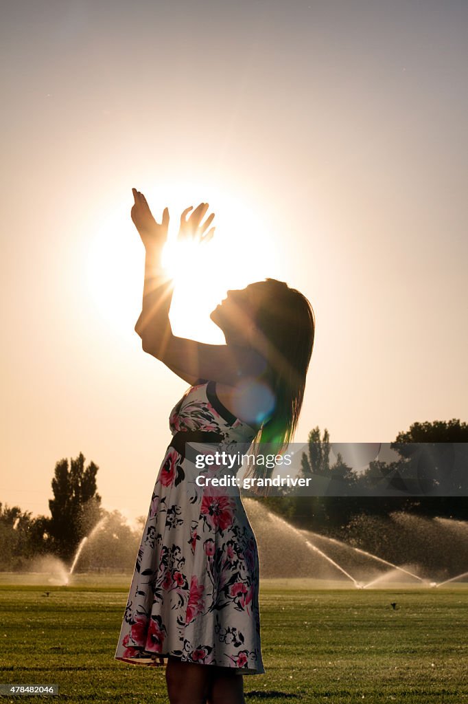 American Indian Girl Holding the Sun