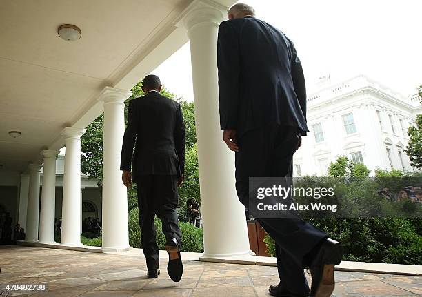 President Barack Obama , and Vice President Joe Biden , come out from the Oval Office for a statement on the Supreme Court health care decision in...