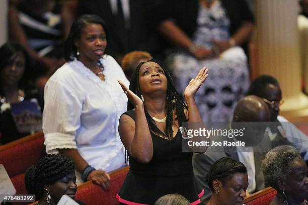 Mourner look up the funeral service of Ethel Lance who was one of nine victims of a mass shooting at the Emanuel African Methodist Episcopal Church,...