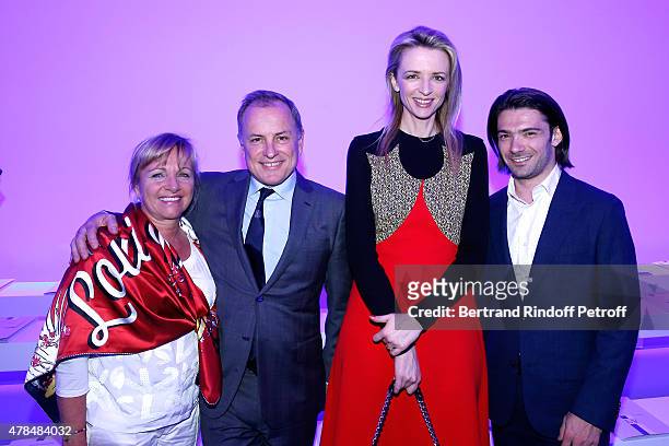 Chairman and Chief Executive Officer of Louis Vuitton, Michael Burke with his wife Brigitte, Louis Vuitton's executive vice president, Delphine...