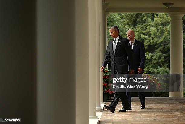 President Barack Obama , and Vice President Joe Biden , come out from the Oval Office for a statement on the Supreme Court health care decision in...