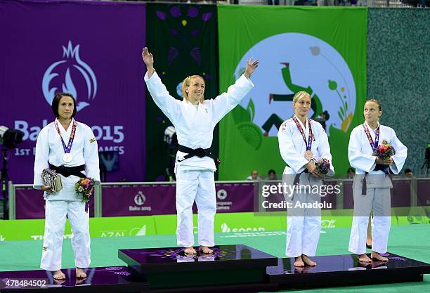 Silver medalist Turkey's Ebru Sahin and Belgium's Charline van Snick pose after their women's -48kg judo final match at the Baku 2015 European Games,...