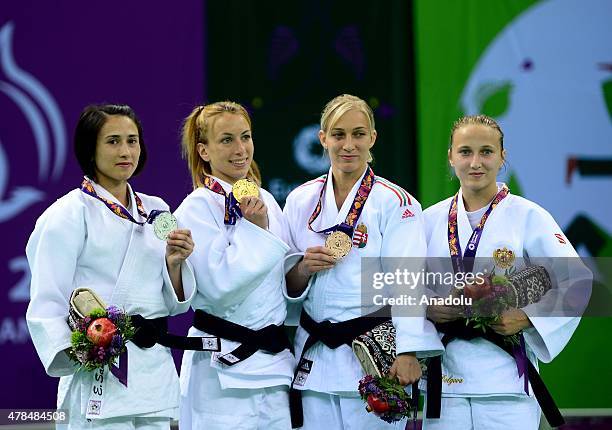 Silver medalist Turkey's Ebru Sahin and Belgium's Charline van Snick pose after their women's -48kg judo final match at the Baku 2015 European Games,...