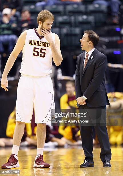 Richard Pitino the head coach of the Minnesota Golden Gophers gives instructions to Elliott Eliason in the game against the Penn State Nittany Lions...