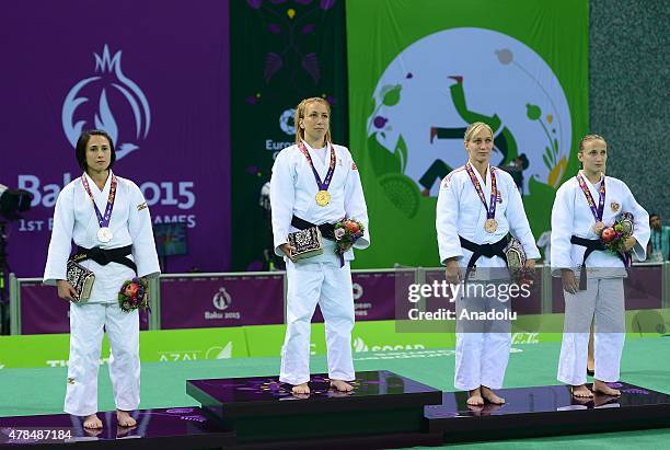 Silver medalist Turkey's Ebru Sahin and Belgium's Charline van Snick pose after their women's -48kg judo final match at the Baku 2015 European Games,...