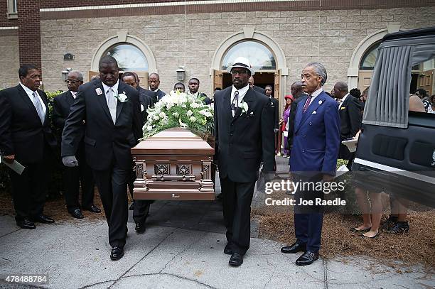 The Rev. Al Sharpton stands near the hearse as pallbearers carry the casket of Ethel Lance who was one of nine victims of a mass shooting at the...