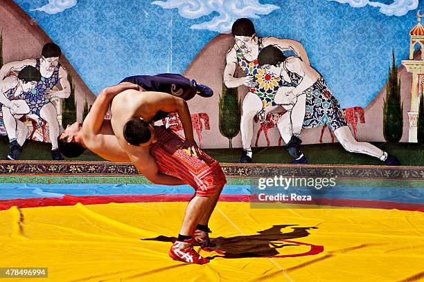 March 19 Baku Boulevard, Baku, Azerbaijan. As part of a Novruz ceremony, these men are competing in a wrestling match. The history of Novruz in...