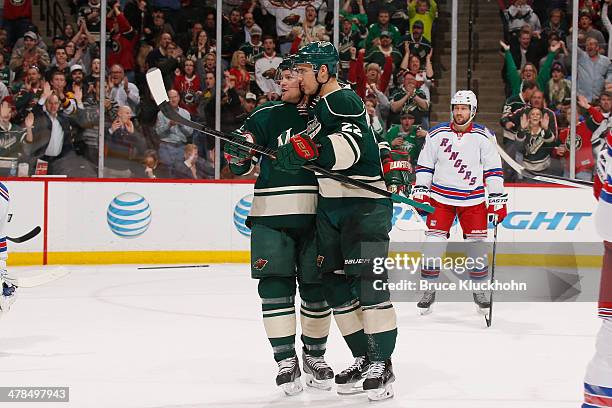 Nino Niederreiter celebrates with his Minnesota Wild teammate Matt Cooke after scoring a goal against the New York Rangers during the game on March...