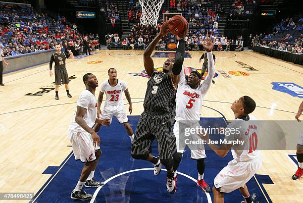 Isaiah Sykes of the UCF Knights drives to the basket against Justin Jackson of the Cincinnati Bearcats during the quarterfinal round of the American...