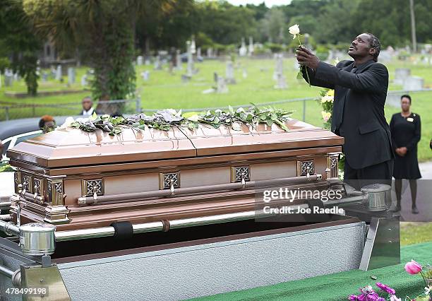 Gary Washington spends a moment with his mother, Ethel Lance before she is buried at the AME Church cemetery, she was one of nine victims of a mass...