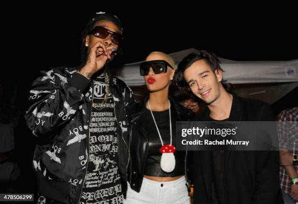 Rapper Wiz Khalifa, model Amber Rose, and musician Matthew Healy, of The 1975, attend the 2014 mtvU Woodie Awards and Festival on March 13, 2014 in...