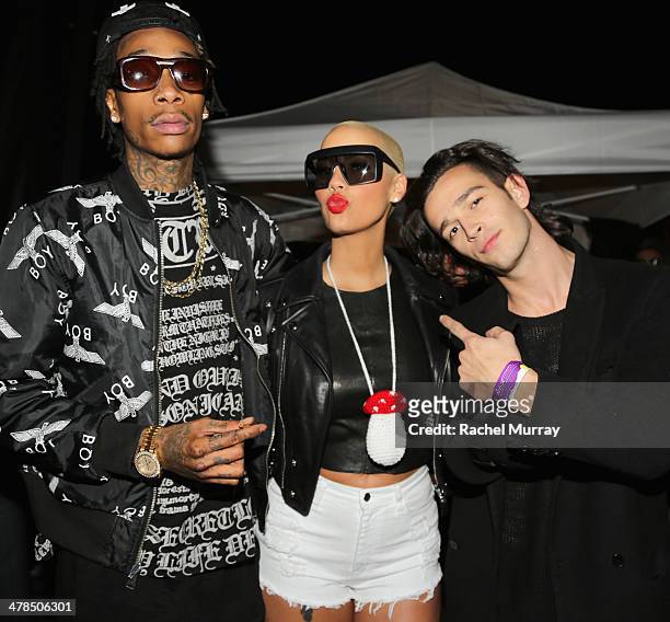 Rapper Wiz Khalifa, model Amber Rose, and musician Matthew Healy, of The 1975, attend the 2014 mtvU Woodie Awards and Festival on March 13, 2014 in...