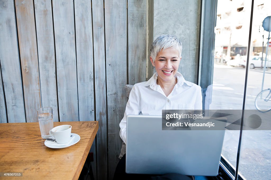Business woman working at cafe