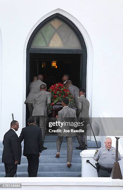 Pallbearers take the casket of church pastor and South Carolina State Sen. Clementa Pinckney into the Emanuel African Methodist Episcopal Church...