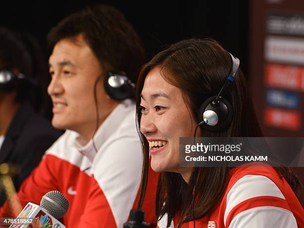 China's national team defender Wu Haiyan and coach Hoa Wei hold a press conference at Lansdowne Stadium in Ottawa on June 25, 2015 on the eve of...