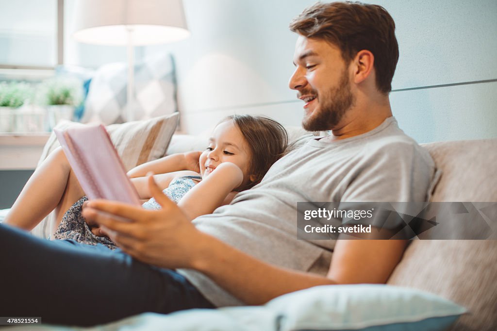 Father and daughter enjoying at home.