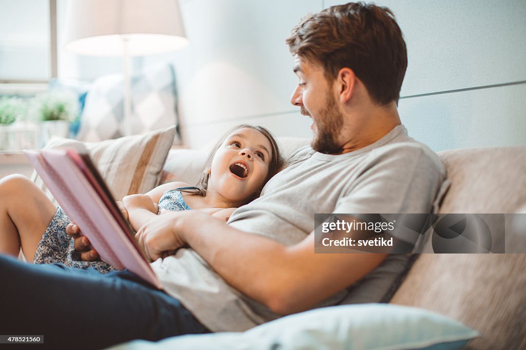 Father and daughter enjoying at home.