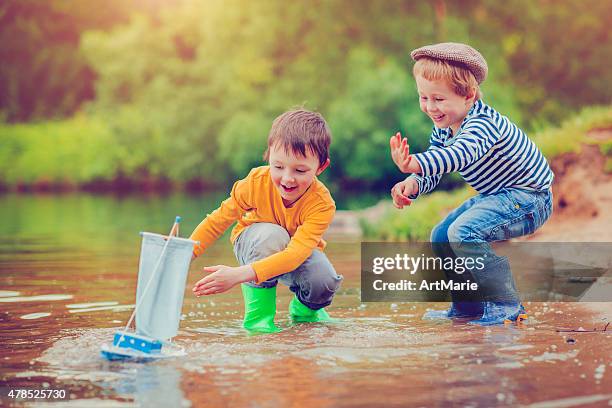 children with toy ship - toy boat stock pictures, royalty-free photos & images