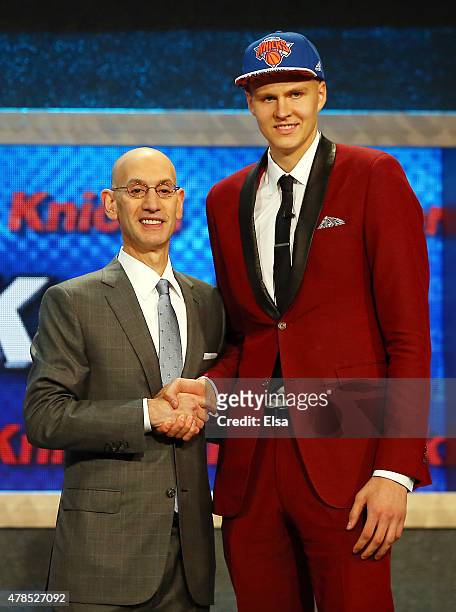 Kristaps Porzingis poses with Commissioner Adam Silver after being selected fourth overall by the New York Knicks in the First Round of the 2015 NBA...