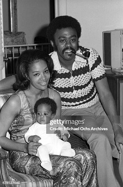 Soul singer Johnnie Taylor poses for a portrait with his wife Gerlean Rockett and their child at the Beverly Hills Hotel on July 10, 1972 in Los...