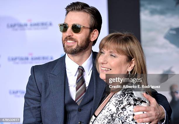Actor Chris Evans and Lisa Evans attend Marvel's "Captain America: The Winter Soldier" premiere at the El Capitan Theatre on March 13, 2014 in...