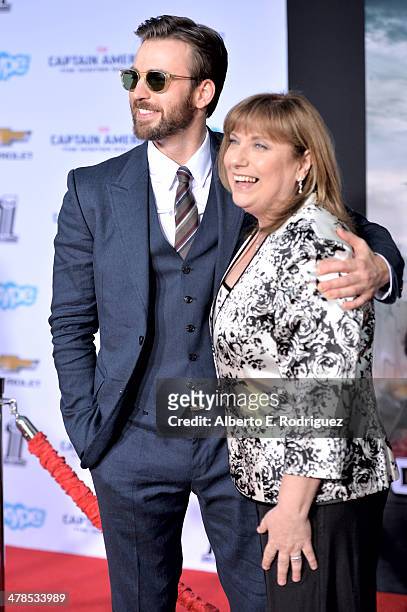 Actor Chris Evans and Lisa Evans attend Marvel's "Captain America: The Winter Soldier" premiere at the El Capitan Theatre on March 13, 2014 in...