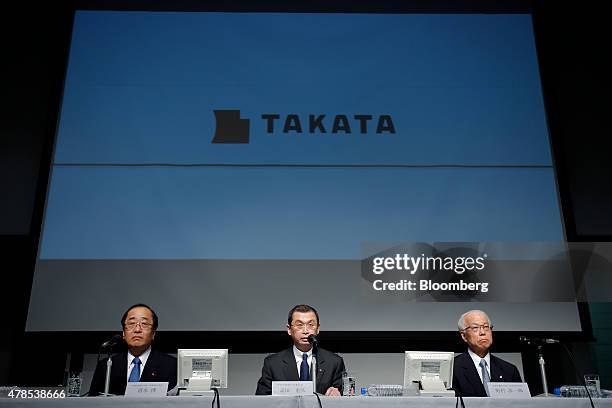 Shigehisa Takada, chairman and president of Takata Corp., center, speaks while Hiroshi Shimizu, executive vice president, left, and Yoichiro Nomura,...