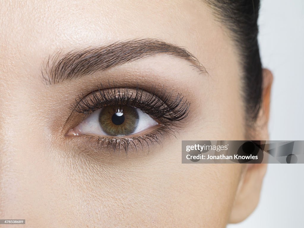 Young woman wearing eye make-up, close-up