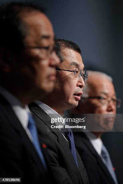 Shigehisa Takada, chairman and president of Takata Corp., center, speaks while Hiroshi Shimizu, executive vice president, left, and Yoichiro Nomura,...
