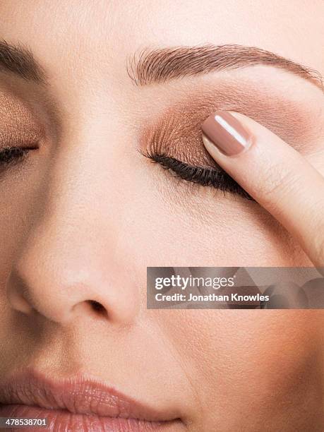 female with closed eyes, finger on eyelid - itchy eyes stock pictures, royalty-free photos & images