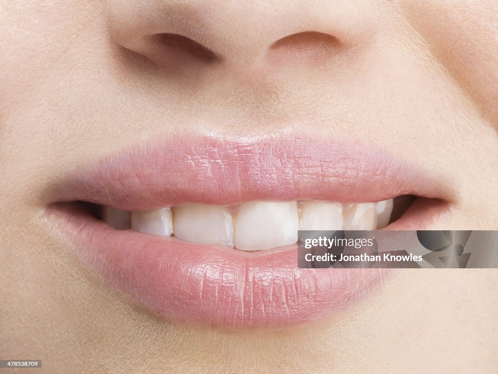 Female smiling with perfect teeth, natural