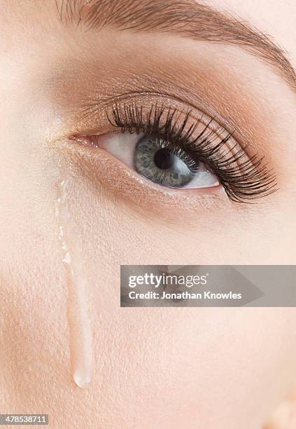 tears down female face, close up - teardrop stockfoto's en -beelden