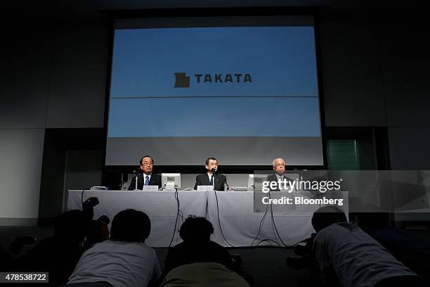 Hiroshi Shimizu, executive vice president of Takata Corp., from left on stage, Shigehisa Takada, chairman and president, and Yoichiro Nomura, chief...