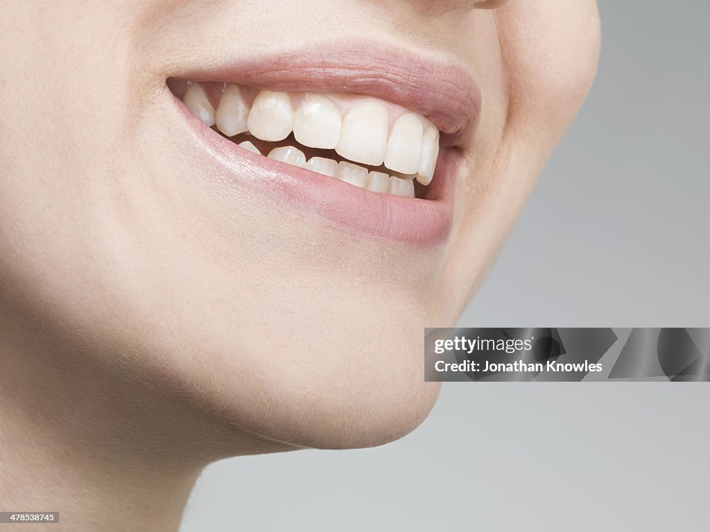 Female smiling with perfect teeth, natural