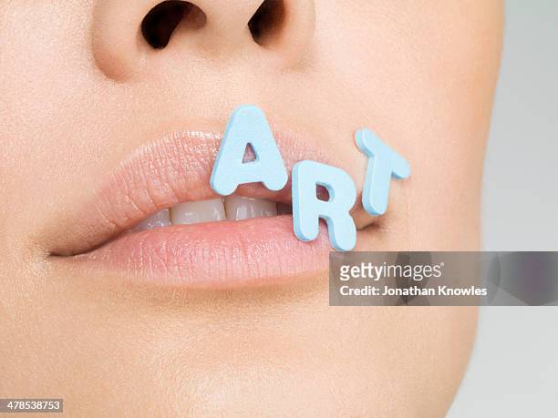 female with letters forming word art on lips - word of mouth stock-fotos und bilder