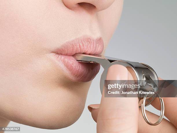 young female blowing a whistle - whistleblower stock pictures, royalty-free photos & images