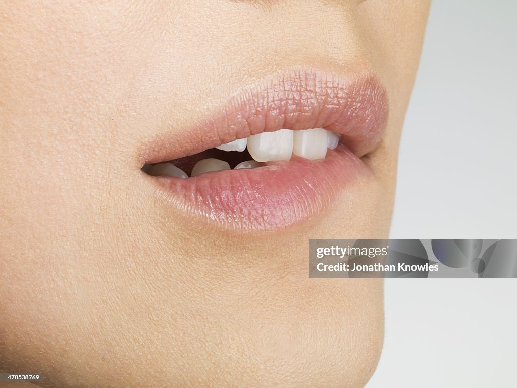 Close up off female biting lip