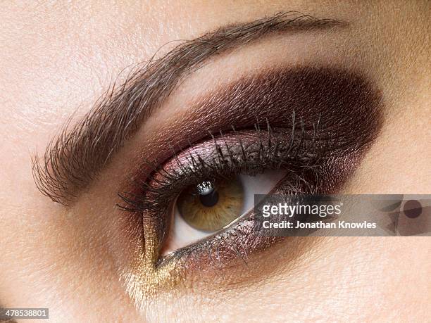 female eye, make up, close-up - sombra de ojos ahumada fotografías e im�ágenes de stock