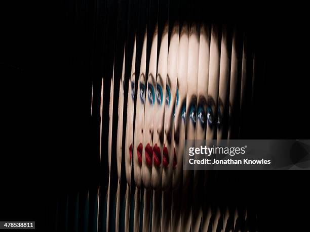 portrait of female through glass - viso nascosto foto e immagini stock