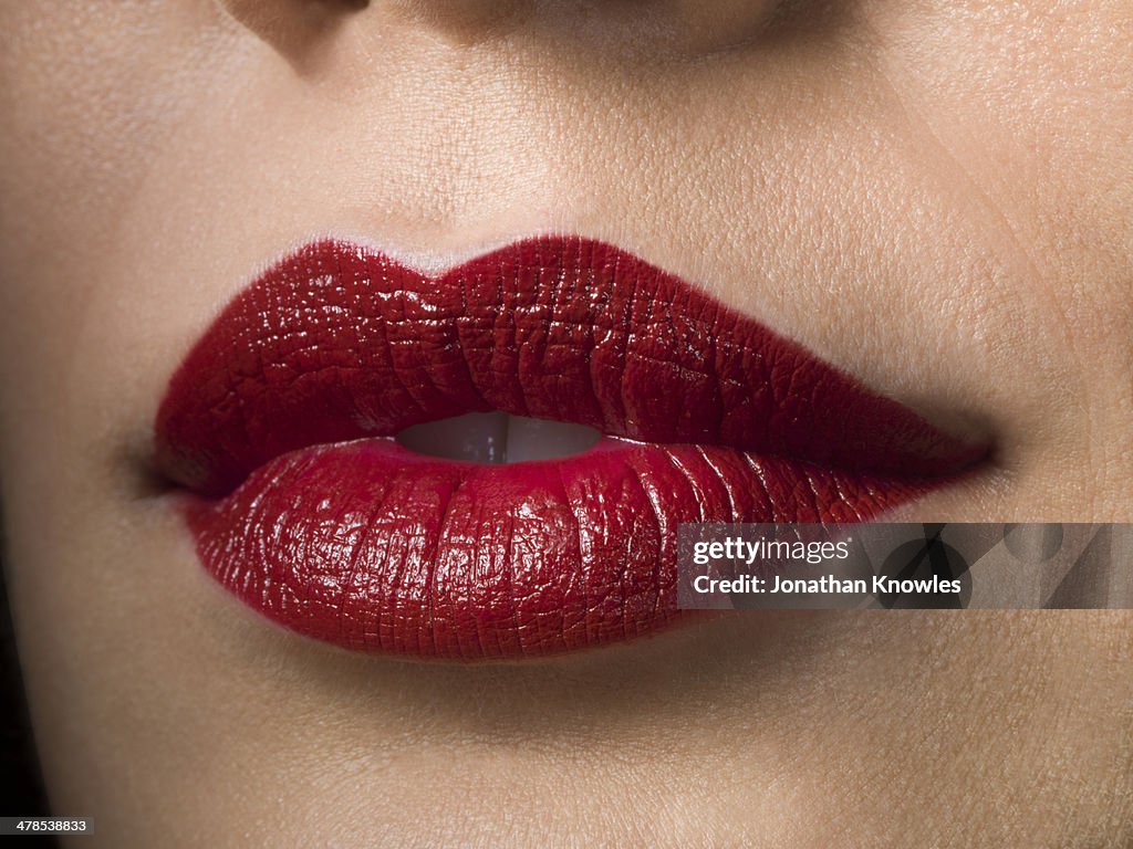 Female with red lipstick on, close up