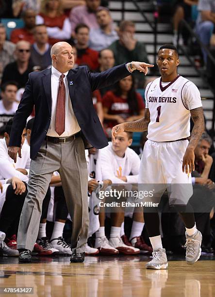 Head coach Herb Sendek of the Arizona State Sun Devils gestures to his players as Jahii Carson walks by during a quarterfinal game of the Pac-12...