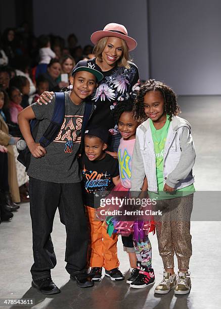 CCandy Clothing owner Amber Sabathia poses with her kids Carsten Charles Sabathia III, Carter Sabathia, Jaden Sabathia and Cyia Sabathia attend the...