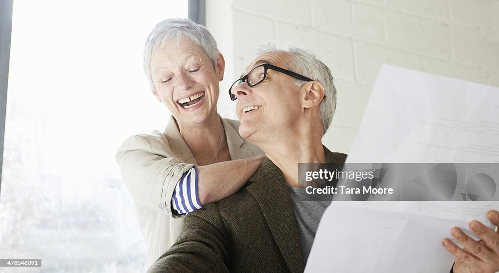 Mature man and woman in office