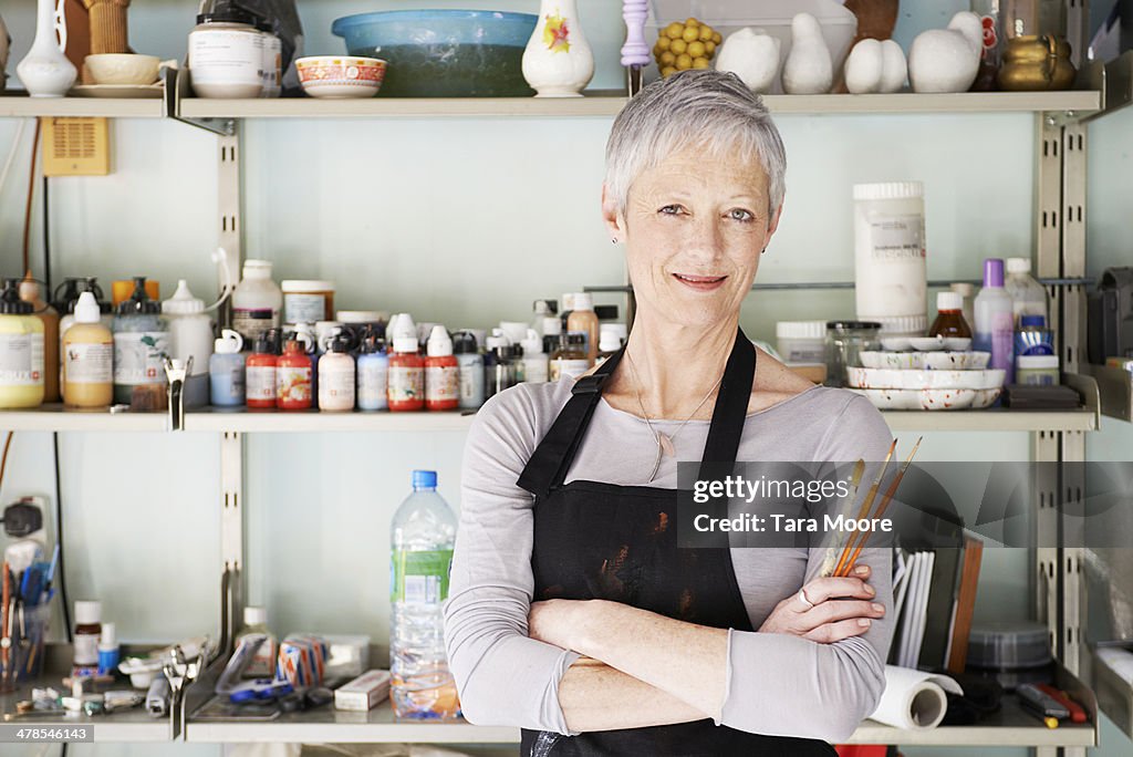 Mature woman in artist's studio