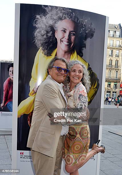 Photographer Oliviero Toscani pose with a model during 'Anti Cliches' Outdoor Exhibition Preview Hosted by Olivier Toscani and Balsamik at Lazare...