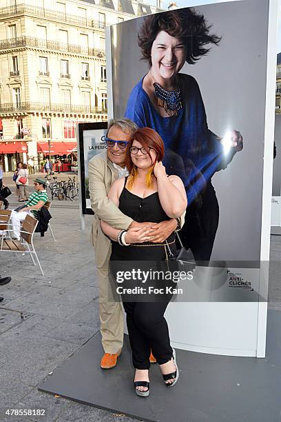 Photographer Oliviero Toscani pose with a model during 'Anti Cliches' Outdoor Exhibition Preview Hosted by Olivier Toscani and Balsamik at Lazare...
