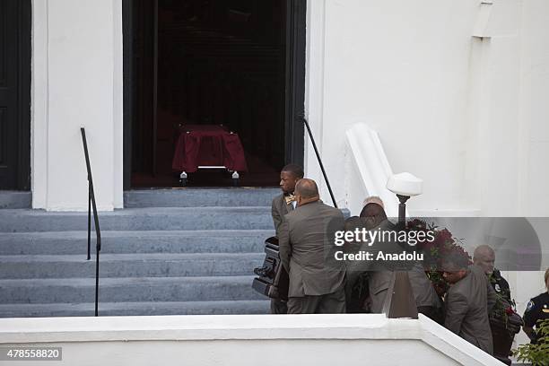 The body of Reverend Clementa Pinckney is carried into Emanuel African Methodist Episcopal Church, a historic black church, who was murdered at the...