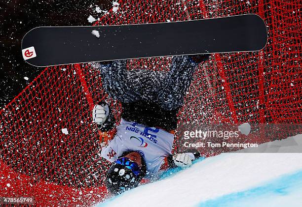 Matti Suur-Hamari of Finland crashes during the Men's Para Snowboard Cross Standing on day seven of the Sochi 2014 Paralympic Winter Games at Rosa...